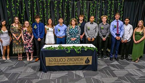 Honors college students at signing with director